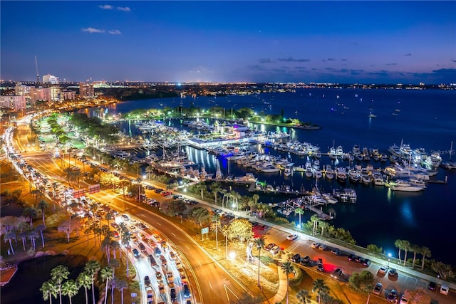 aerial view at dusk with a water view