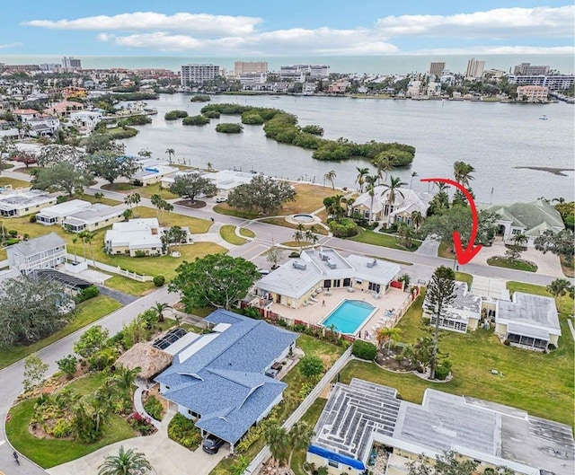 birds eye view of property with a water view