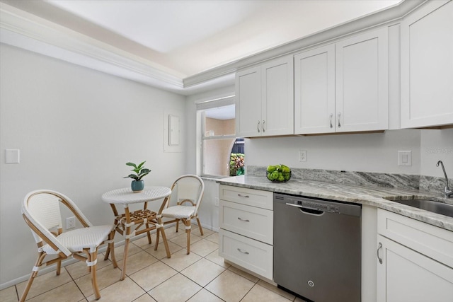 kitchen featuring light tile patterned floors, dishwasher, light stone countertops, white cabinetry, and a sink