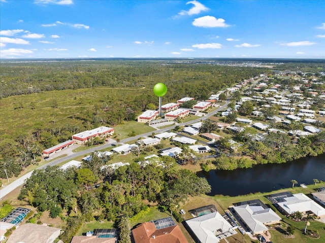 aerial view featuring a water view and a view of trees