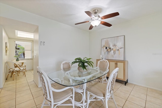 dining room featuring light tile patterned floors and ceiling fan