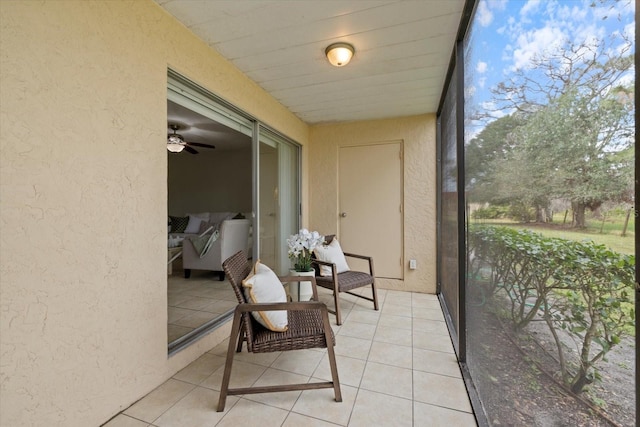 sunroom / solarium with ceiling fan