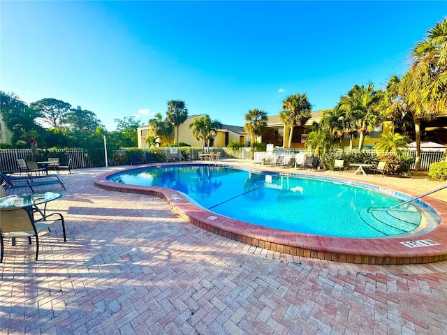 view of swimming pool with a patio