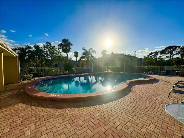 view of swimming pool featuring a patio area