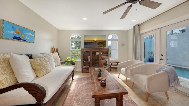 living room with french doors and ceiling fan