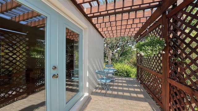 view of patio featuring a pergola and french doors