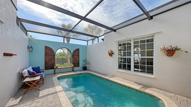 view of pool featuring a lanai