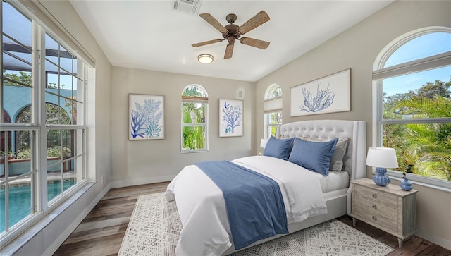 bedroom featuring hardwood / wood-style flooring and ceiling fan