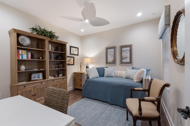 bedroom featuring ceiling fan and dark hardwood / wood-style flooring