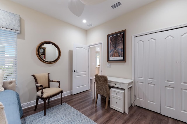 home office with dark wood-type flooring