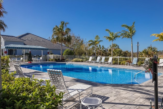 view of swimming pool with a patio