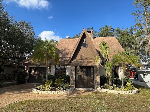 view of front of house featuring a front yard and a garage