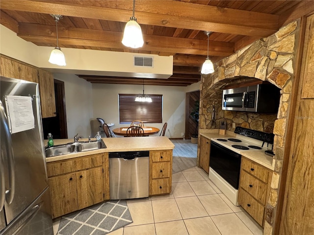 kitchen with stainless steel appliances, sink, beam ceiling, light tile patterned floors, and decorative light fixtures