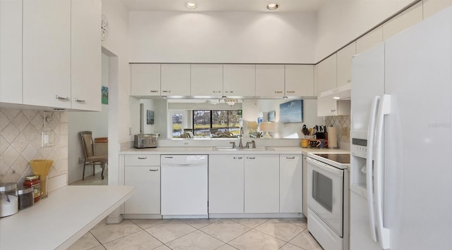 kitchen featuring white cabinets, white appliances, sink, and light tile patterned floors