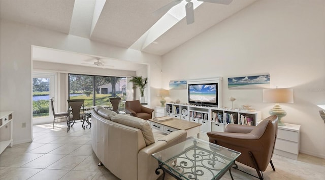 living room with ceiling fan, high vaulted ceiling, light tile patterned flooring, a textured ceiling, and a water view