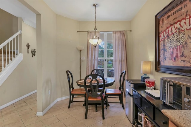 dining area with light tile patterned floors