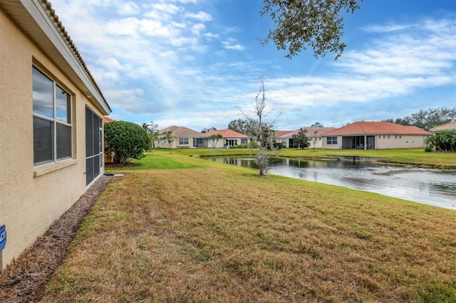 view of yard with a water view