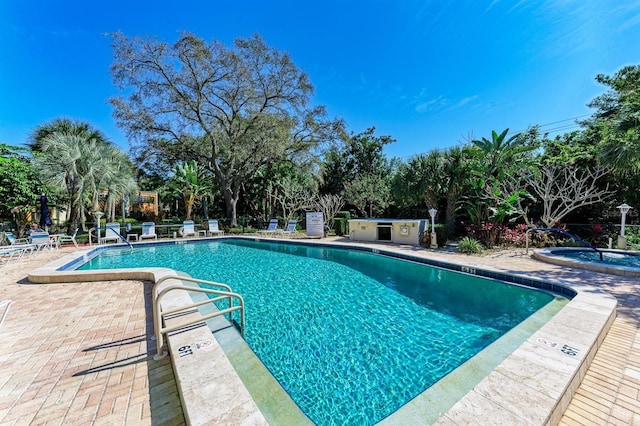 view of swimming pool with a patio