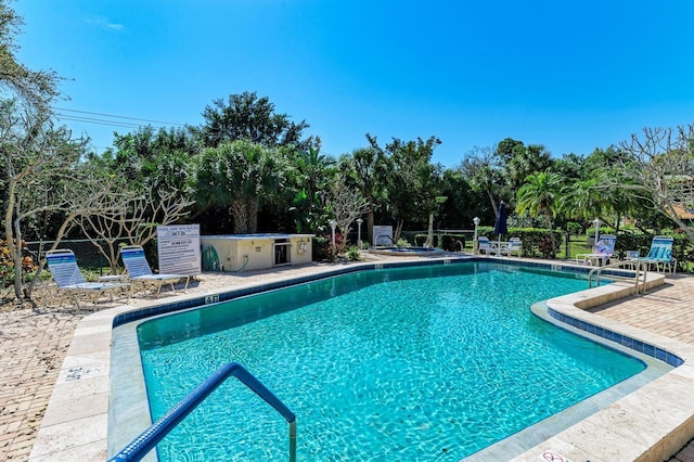 view of swimming pool featuring a patio