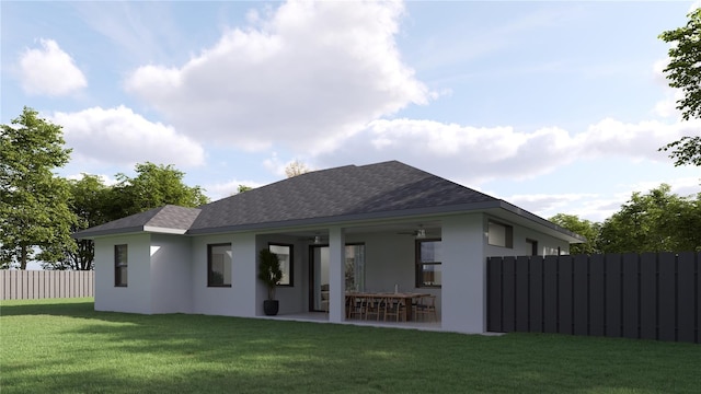 back of house featuring a yard, ceiling fan, and a patio area