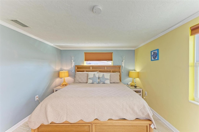 bedroom with a textured ceiling and crown molding