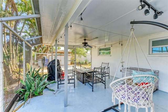 view of patio featuring ceiling fan, a lanai, and grilling area