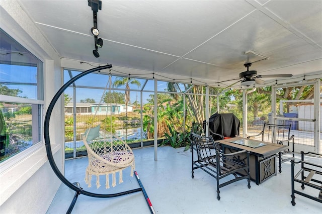 sunroom / solarium with ceiling fan