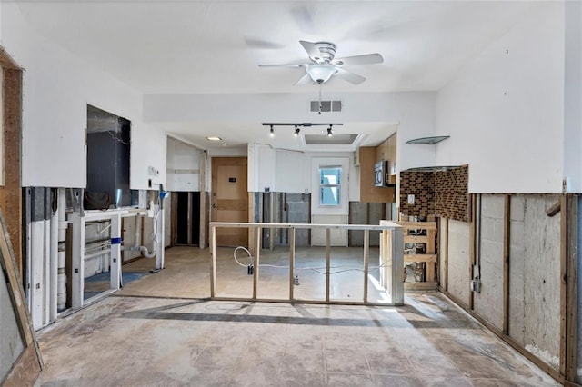 interior space featuring ceiling fan