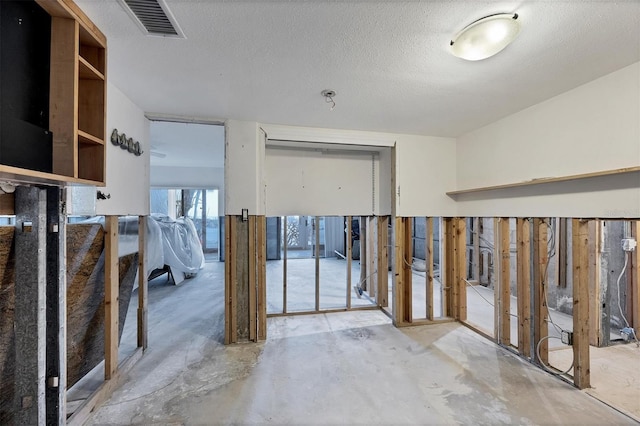 interior space featuring a textured ceiling