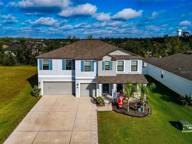 view of front of home featuring a front yard and a garage