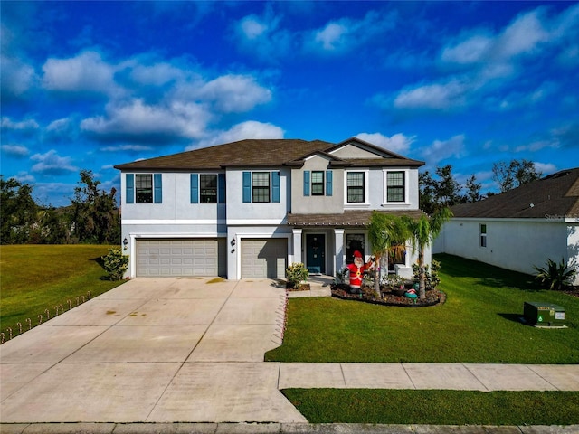 view of front of house featuring a garage and a front lawn