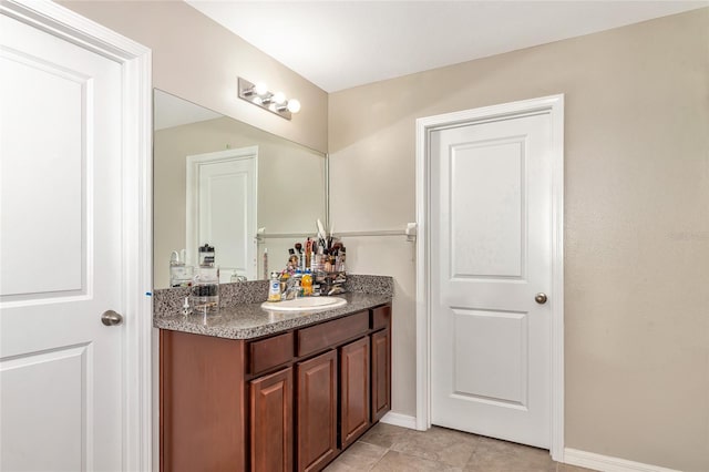 bathroom featuring tile patterned floors and vanity