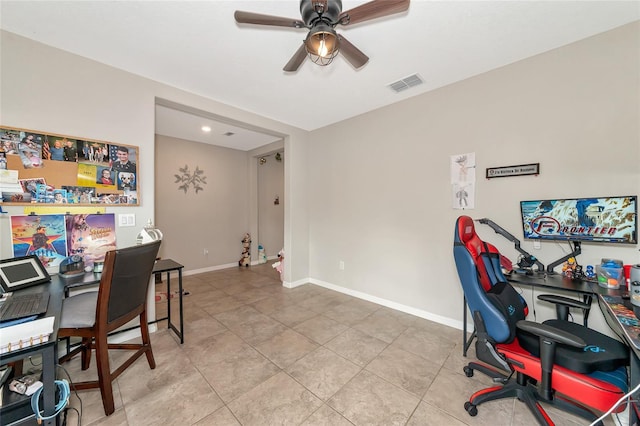 office space featuring light tile patterned flooring and ceiling fan