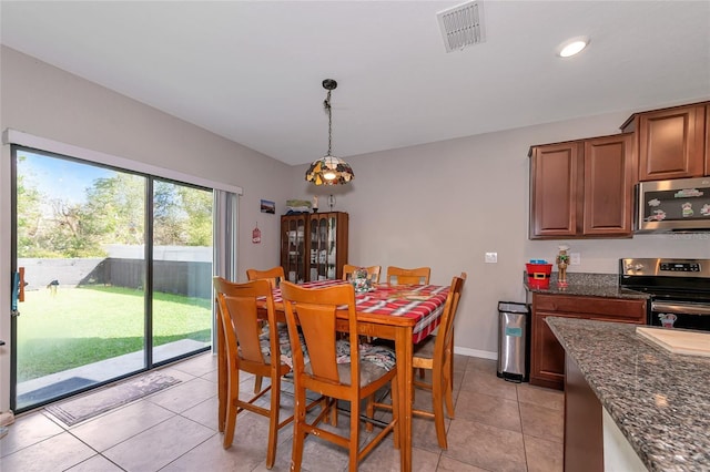 dining room featuring light tile patterned floors