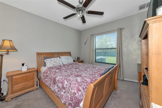 bedroom featuring ceiling fan and light carpet