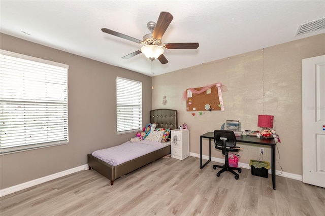 bedroom with ceiling fan and light hardwood / wood-style flooring