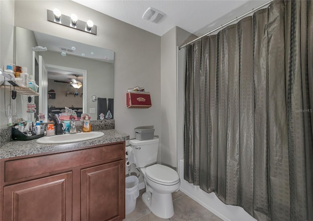 bathroom featuring toilet, tile patterned flooring, vanity, and ceiling fan