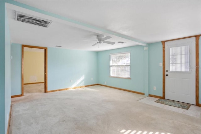 entryway with ceiling fan and light colored carpet