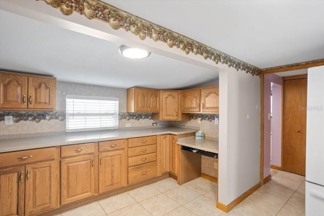 kitchen with decorative backsplash and light tile patterned floors