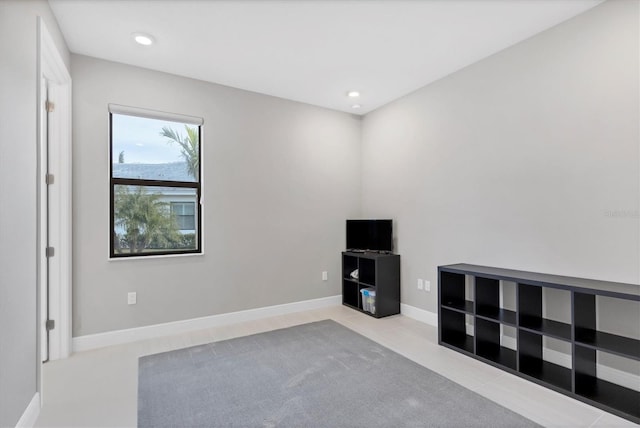 misc room with light tile patterned floors