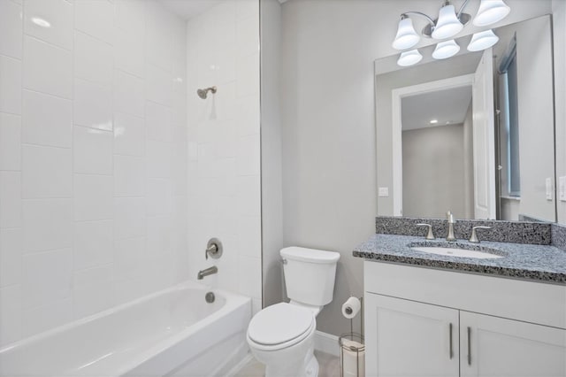 full bathroom featuring vanity, toilet, tiled shower / bath, and a notable chandelier