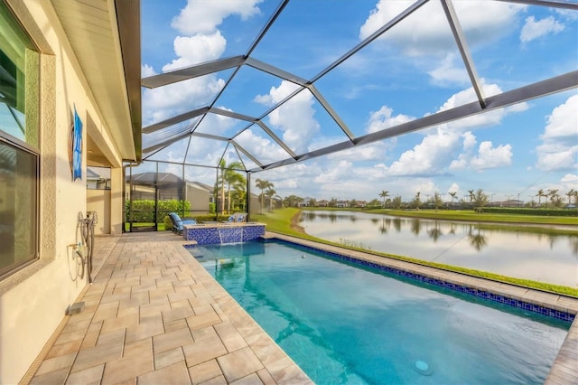 view of swimming pool featuring a lanai, pool water feature, a water view, a patio, and a hot tub