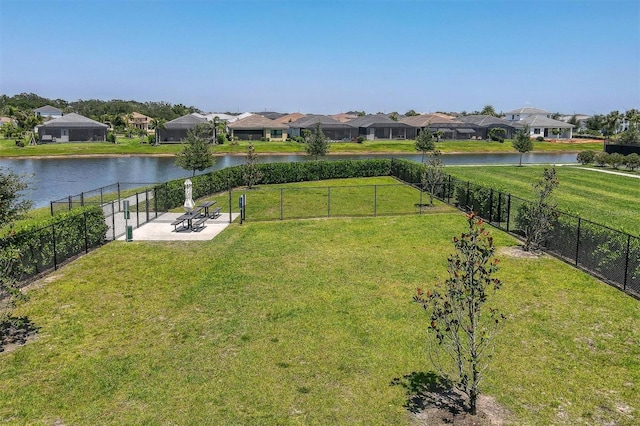 view of yard featuring a patio area and a water view