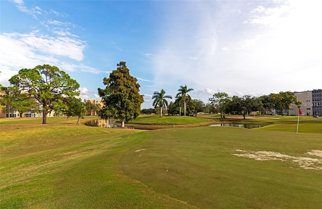 surrounding community featuring a yard and a water view