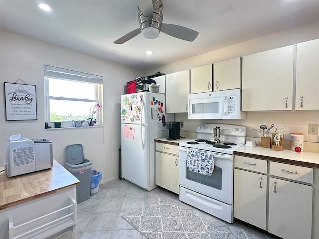 kitchen with white appliances, white cabinetry, ceiling fan, and light tile patterned flooring