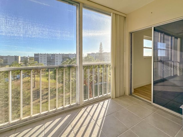 unfurnished sunroom featuring a wealth of natural light