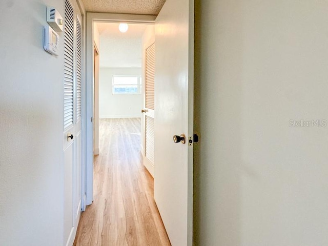 hall with light wood-type flooring