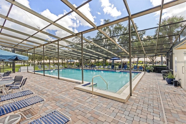 view of pool featuring a lanai and a patio