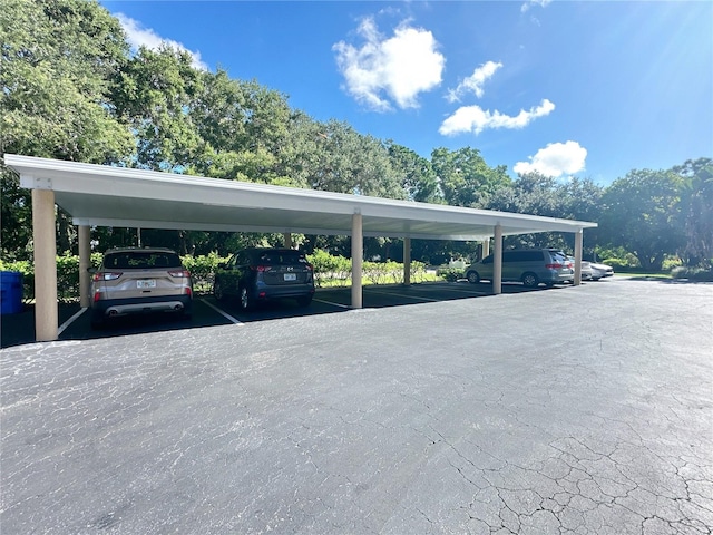 view of vehicle parking with a carport