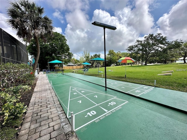 view of home's community with a yard